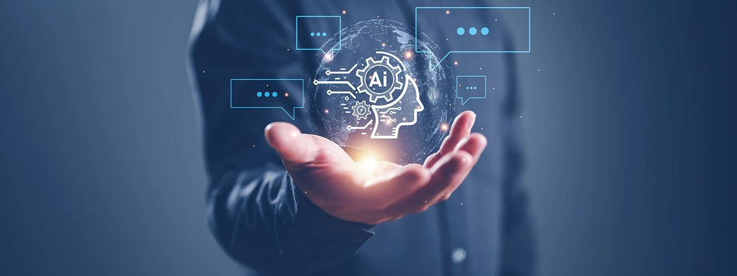 A person extends a glowing holographic AI brain and circuit icons above an open palm, symbolizing AI in hand with chat bubbles around it.